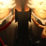 An einer Audiostation sitzen sich zwei Personen mit Kopfhörern gegenüber, im Hintergrund sind große Porträts von Franz Joseph Haydn zu sehen.