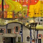 Modell eines farbenfrohen, abstrakten Gebäudes mit geschwungenen Linien und quadratischen Fenstern, eingebettet in eine Miniaturlandschaft mit gemalten Bäumen und einer lebendigen, künstlerischen Kulisse.