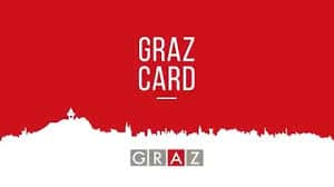 Rot-weiße Grafik mit dem Schriftzug "Graz Card" und einer weißen Stadtsilhouette; "Graz" ist in einzelnen farbigen Blöcken am unteren Rand geschrieben.