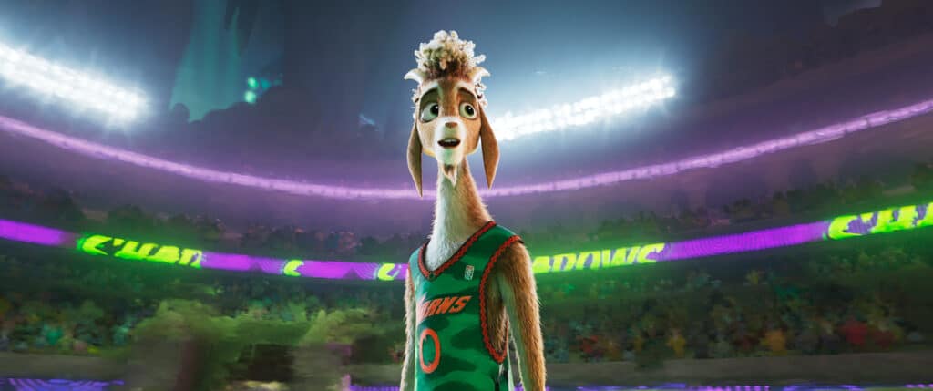 Eine animierte anthropomorphe Ziege in einem grünen Basketballtrikot steht auf einem hell erleuchteten Platz mit einer Menschenmenge im Hintergrund.