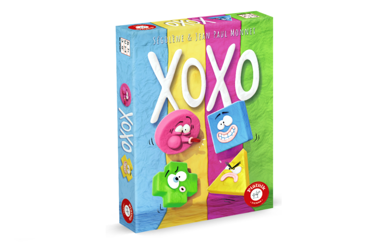 Bunte Schachtel des Brettspiels "XOXO" mit verspielten Cartoon-Formen und den Namen Sébastien und Jean Paul Mouret, empfohlen ab 6 Jahren.