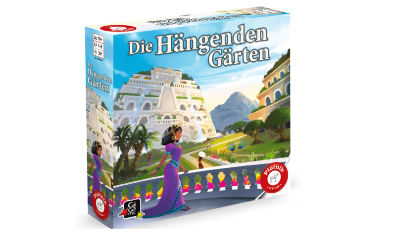 Eine farbenfrohe Spielschachtel mit dem Titel "Die Hängenden Gärten" zeigt eine Frau in einem lila Kleid, die in einem üppigen, terrassenförmig angelegten Garten steht, mit weißen Gebäuden und Bergen im Hintergrund.