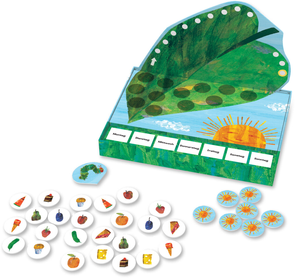 Ein Brettspiel mit einem blattförmigen Spielbrett, einer Sonnenillustration, Wochentagskarten und kreisförmigen Essens- und Raupenplättchen, inspiriert von "The Very Hungry Caterpillar".
