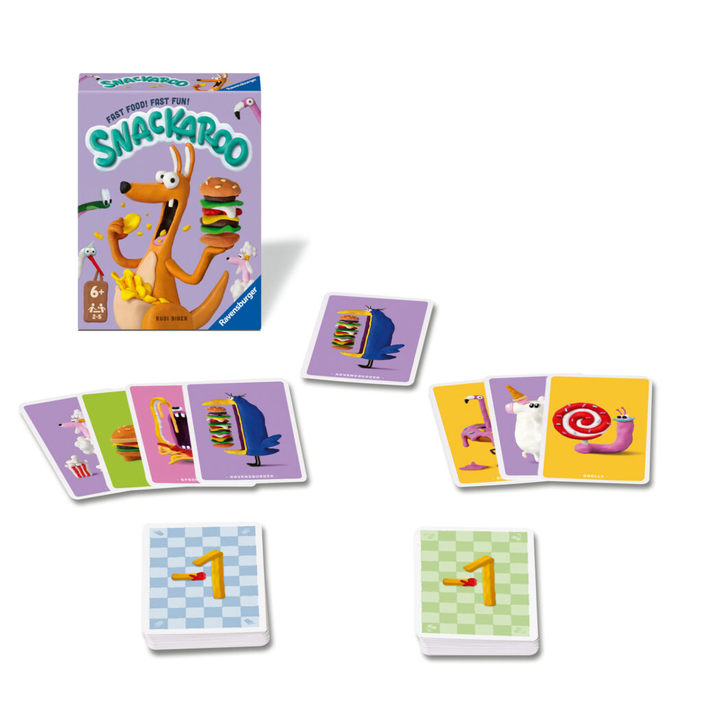 Die Verpackung des Kartenspiels „Snackaroo“ ist abgebildet, mit mehreren bunten Karten und zwei Zahlenplättchen, die auf einer weißen Fläche angeordnet sind.
