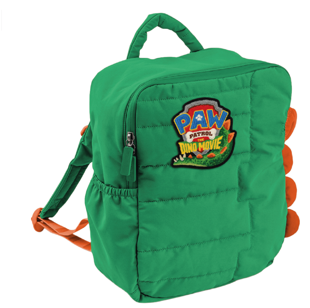 Grüner Kinderrucksack mit orangefarbenen Trägern, Dinosaurier-Stacheln an den Seiten und einem „PAW Patrol Dino Movie“-Aufnäher auf der Vorderseite.