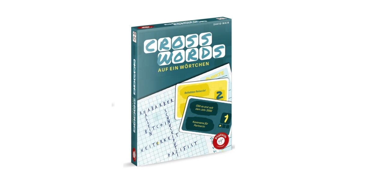 Schachtel für das deutsche Spiel „Cross Words: Auf ein Wörtchen“ mit Motiven zum Thema Kreuzworträtsel und zwei Beispielkarten auf dem Cover.